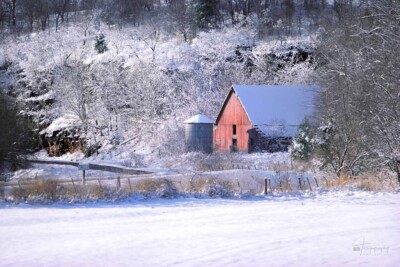A little red barn laden with snow A little red barn laden with snow after a late winter snow in rural Missouri